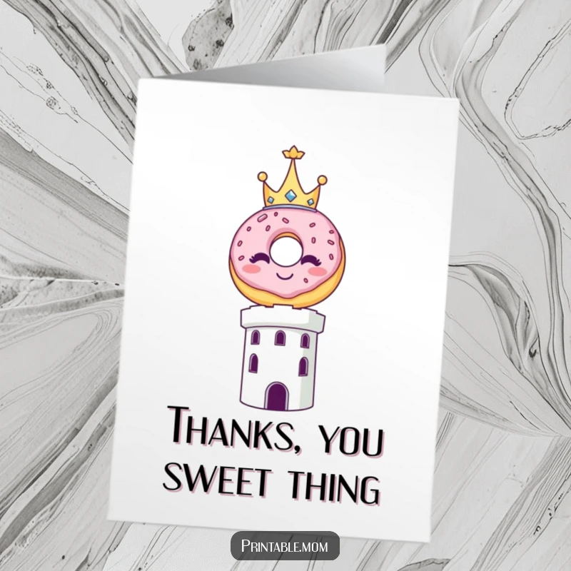 Funny Free Printable Thank You Card: A smiling donut wearing a tiny crown balances carefully on a tower, offering thanks.