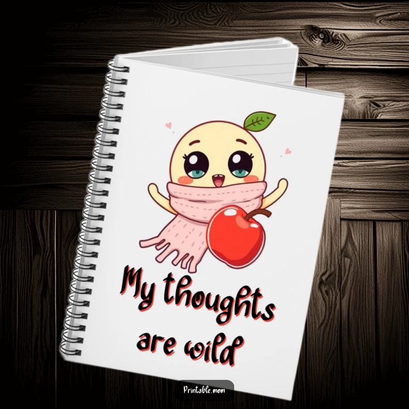 Funny notebook cover displaying a knitted scarf with googly eyes waving at a falling apple, ideal for students and writers.