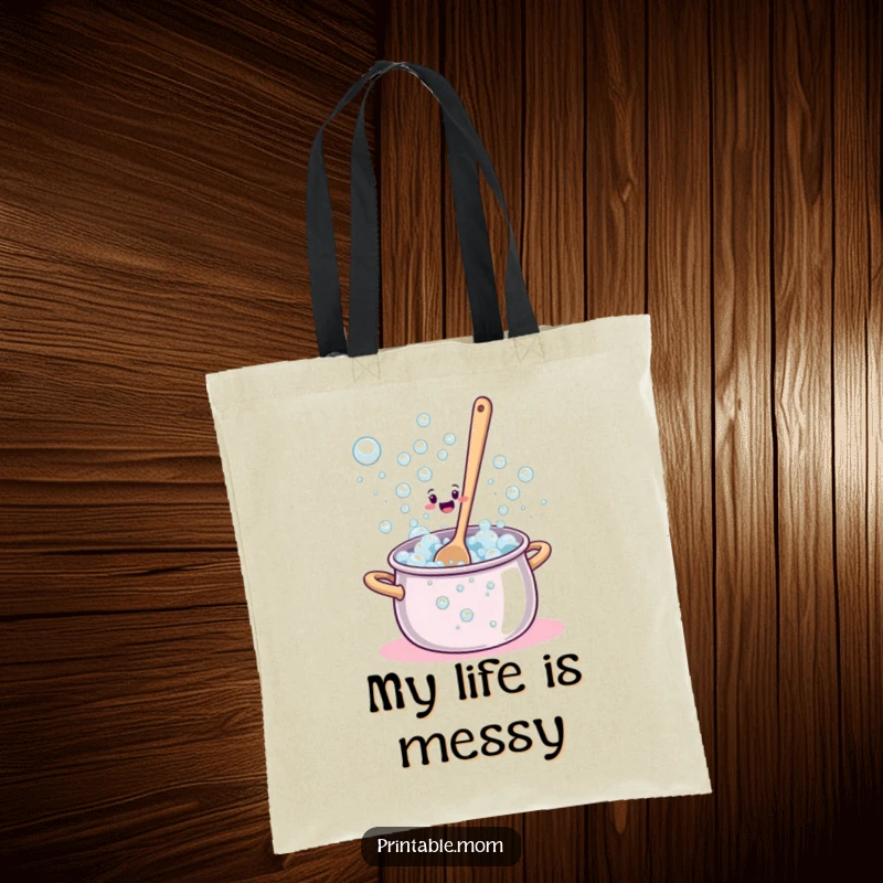 Funny Tote Bag illustrating a bewildered spoon struggling to stir a pot that’s overflowing with bubbles.